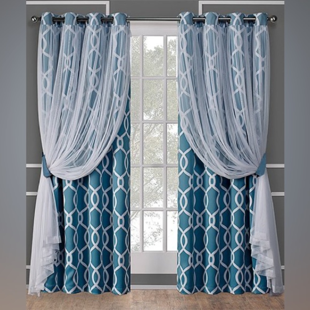 TWO TURQUOISE BLACKOUT CURTAIN PANELS WITH SHEER OVERLAY BUILT IN.